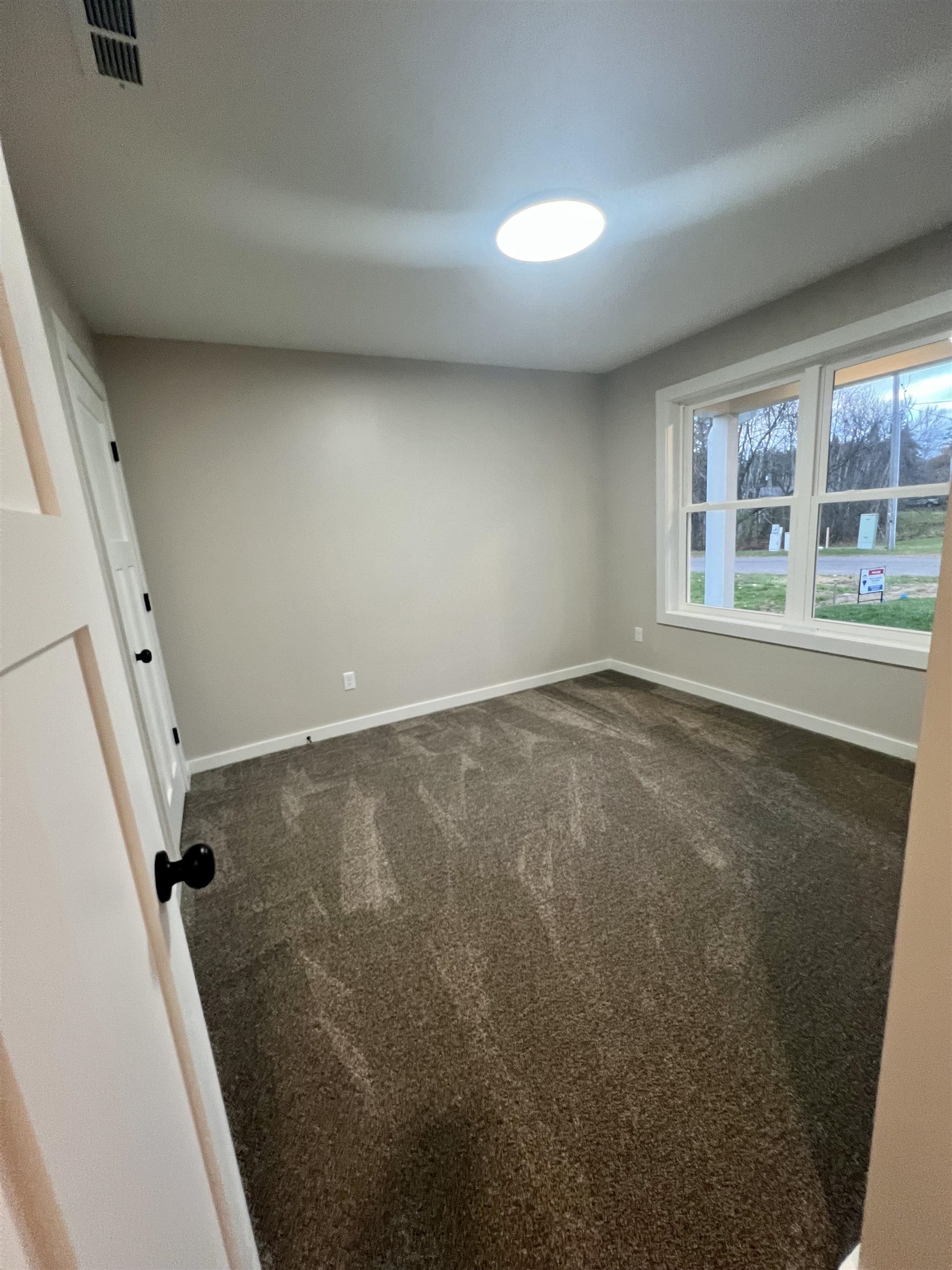 1006 26th Street, Unit B Cloquet, MN 55720 - Photo 10 of 27 Empty room with carpet floors and baseboards