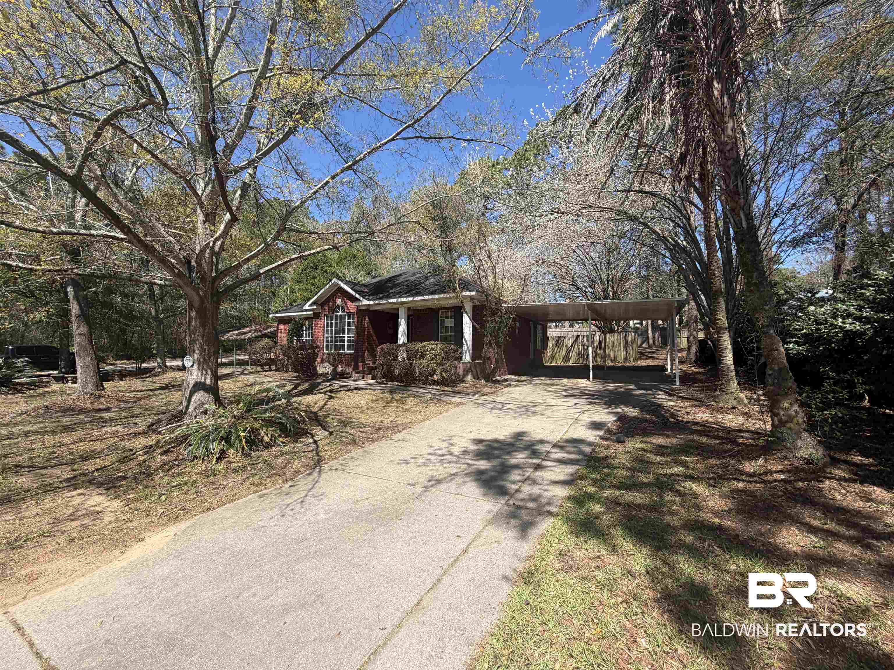 7067 Pinehill Road Daphne, AL 36526 - Photo 3 of 18 Ranch-style home with driveway and a carport