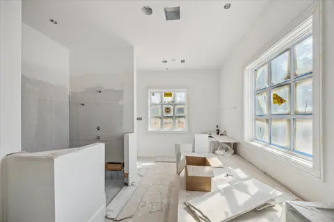 a view of a dining room with furniture and window