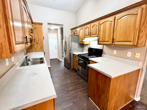 a kitchen that has a cabinets and a stove