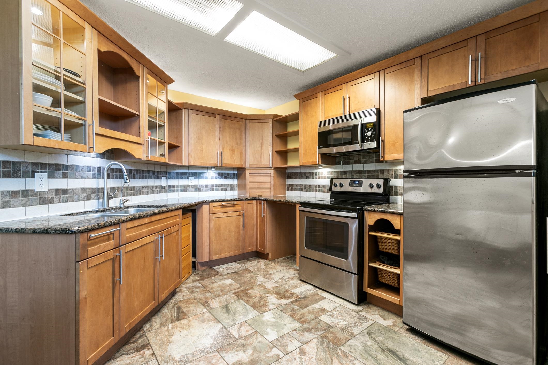 29 Hybiscus Avenue St. Augustine, FL 32084 - Photo 12 of 42 a kitchen with stainless steel appliances granite countertop a stove a sink and a microwave