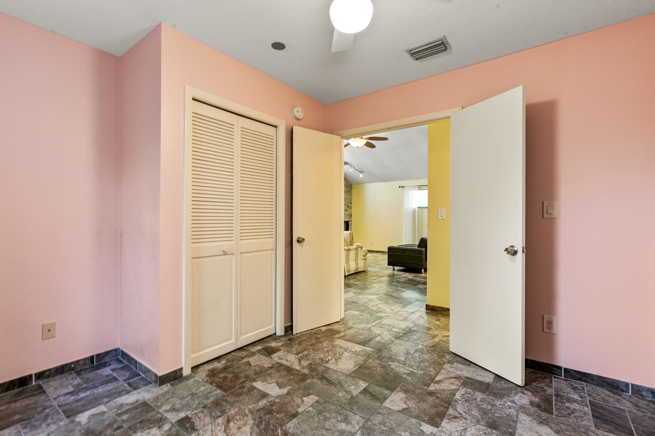 29 Hybiscus Avenue St. Augustine, FL 32084 - Photo 19 of 42 a view of a bathroom with a walk in closet and wooden floor