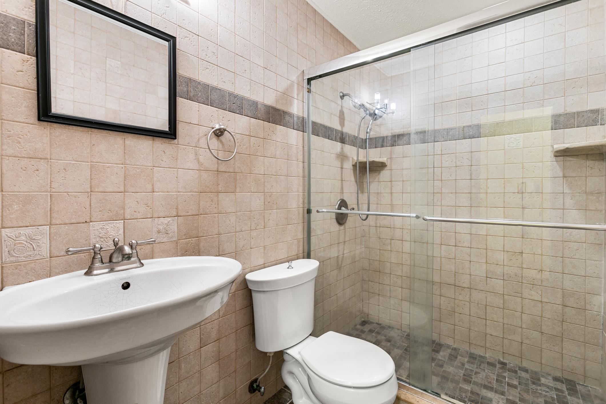 29 Hybiscus Avenue St. Augustine, FL 32084 - Photo 20 of 42 a bathroom with a sink mirror and toilet