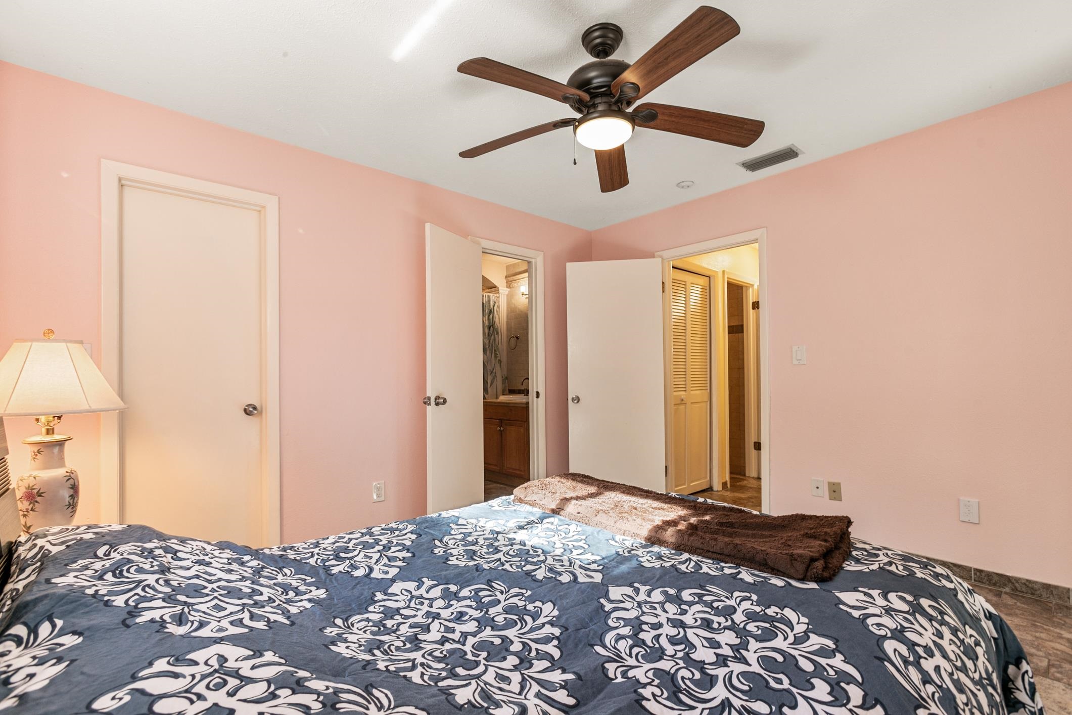 29 Hybiscus Avenue St. Augustine, FL 32084 - Photo 22 of 42 a bedroom with a bed and a chandelier