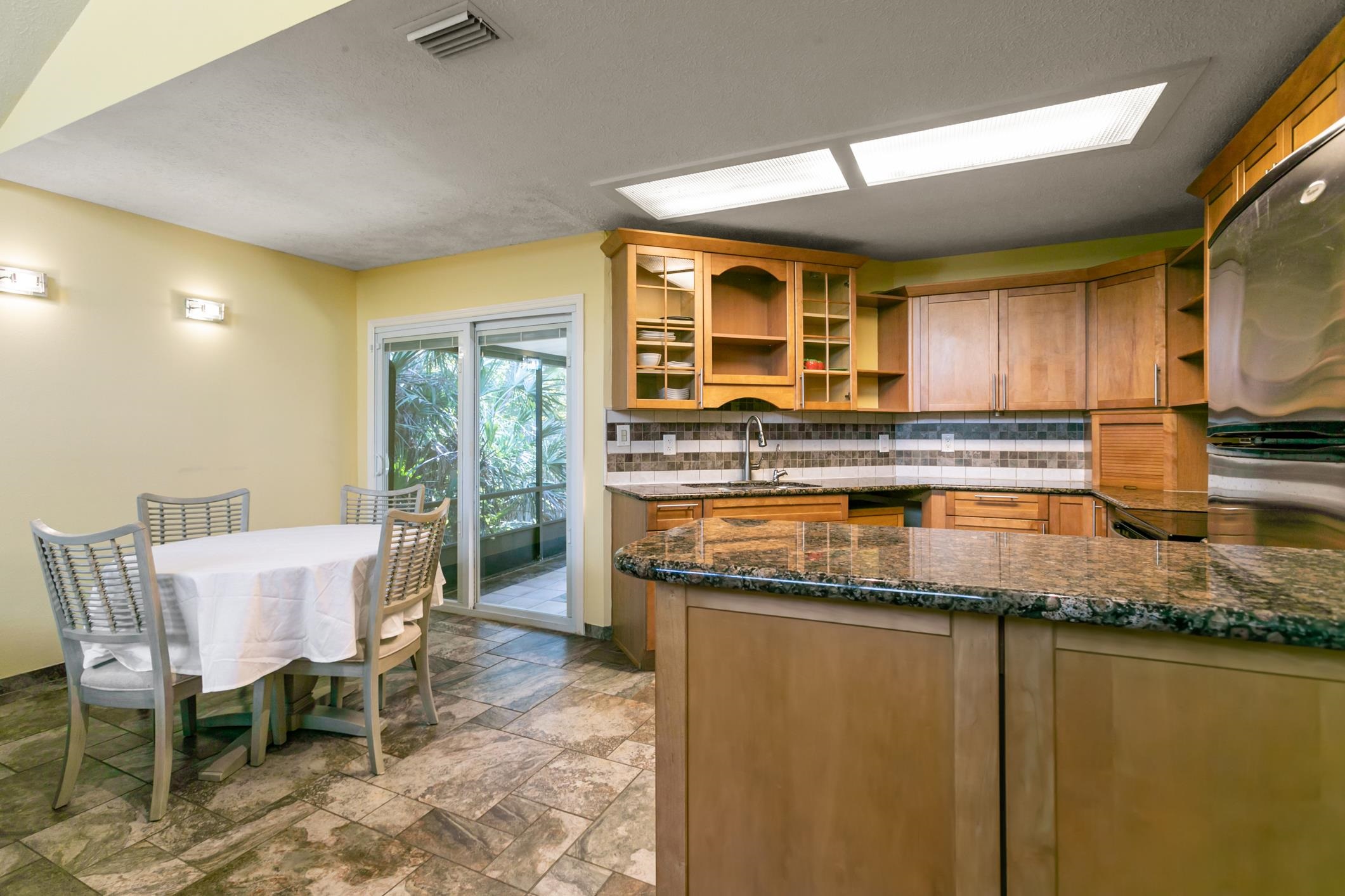 29 Hybiscus Avenue St. Augustine, FL 32084 - Photo 10 of 42 a kitchen with stainless steel appliances granite countertop a stove a sink and a microwave