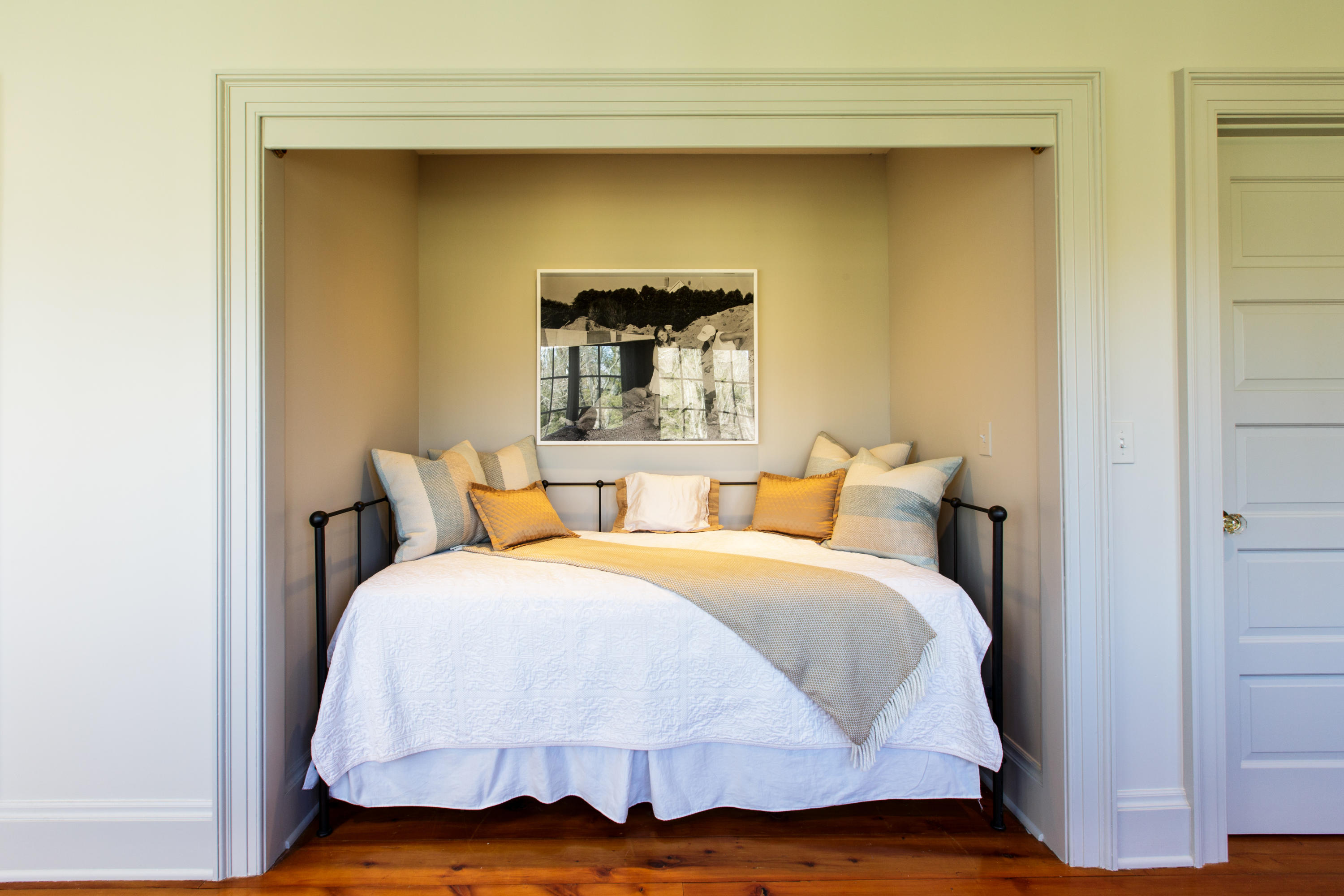 991 Ponus Ridge Road New Canaan, CT 06840 - Photo 5 of 12 a bedroom with a bed and wooden floor