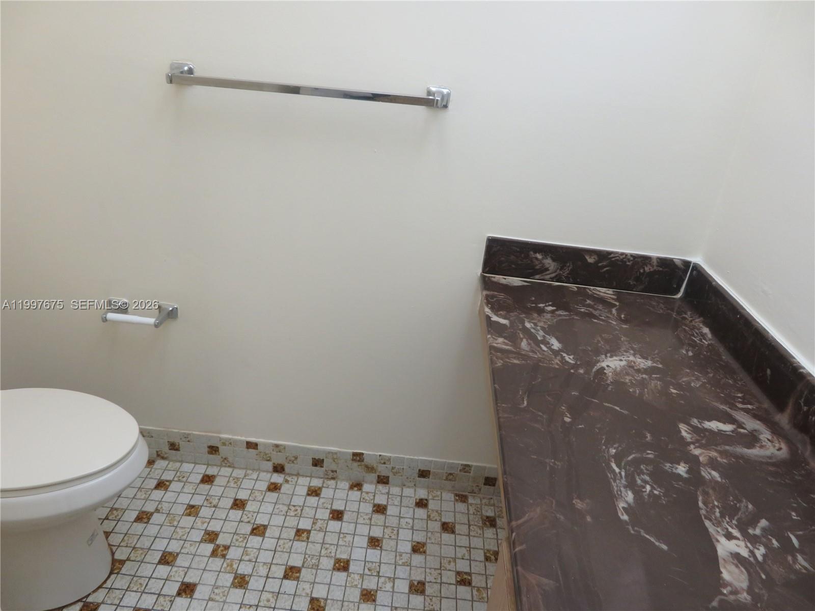 8005 Southwest 107th Avenue, Unit 309 Miami, FL 33173 - Photo 11 of 18 a bathroom with a toilet