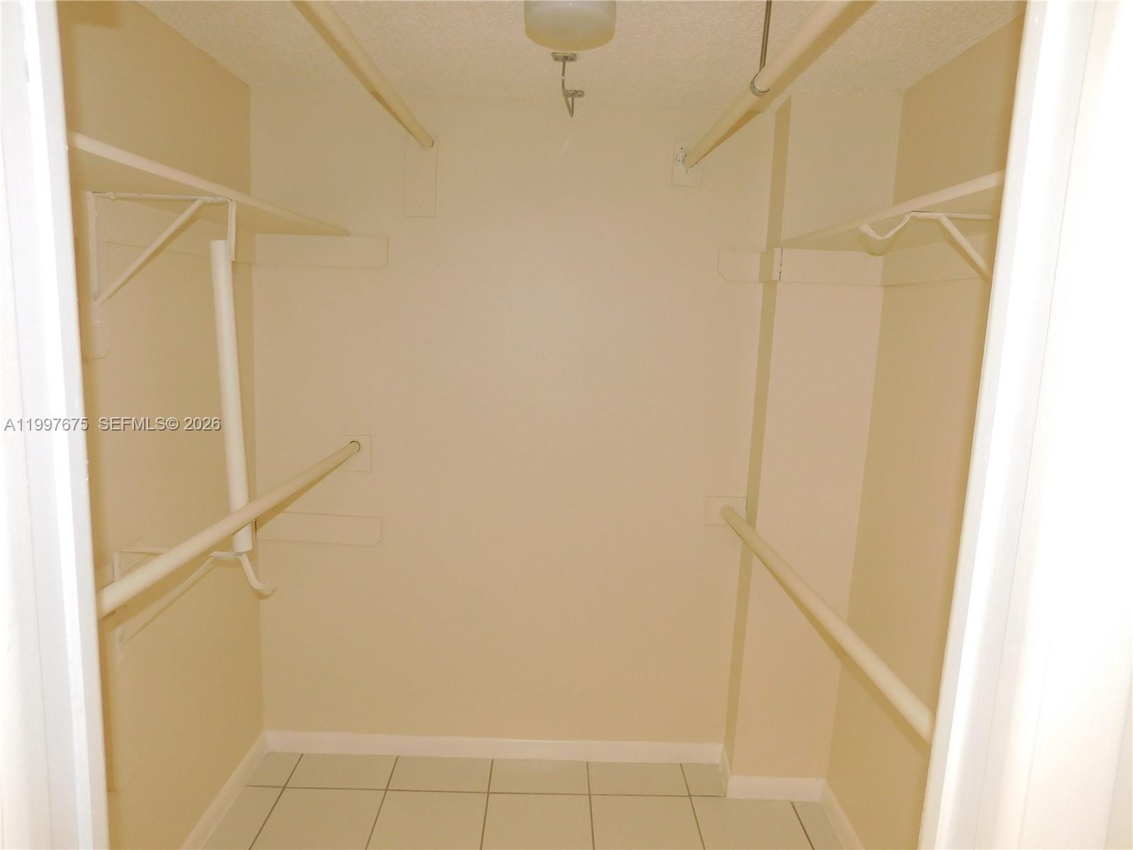 8005 Southwest 107th Avenue, Unit 309 Miami, FL 33173 - Photo 14 of 18 a bathroom with a shower