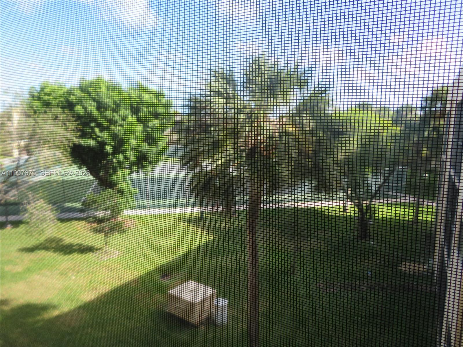 8005 Southwest 107th Avenue, Unit 309 Miami, FL 33173 - Photo 18 of 18 a bathroom with a small yard