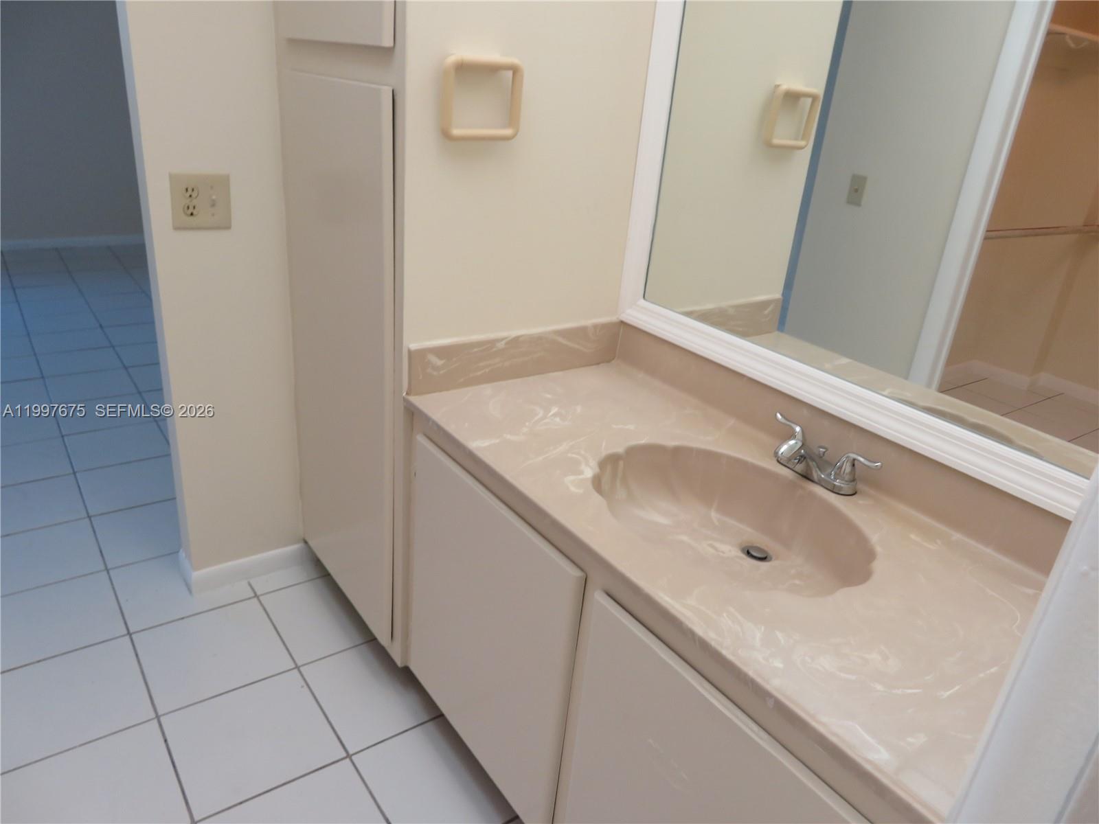 8005 Southwest 107th Avenue, Unit 309 Miami, FL 33173 - Photo 7 of 18 a bathroom with a sink and vanity