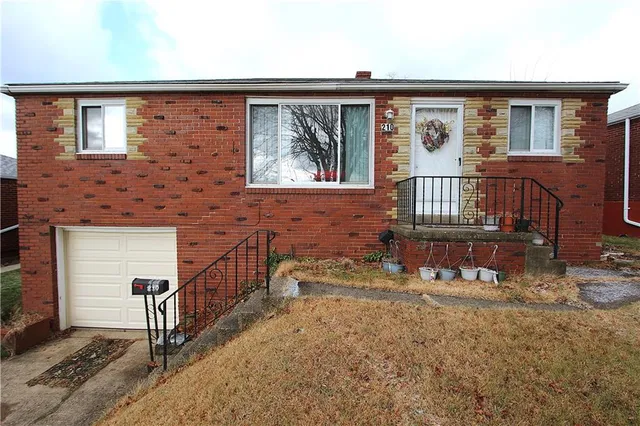 a view of front door of house with stairs