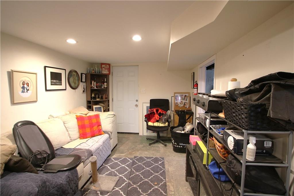 210 Livingston Road West Mifflin, PA 15122 - Photo 11 of 25 a living room with furniture and a flat screen tv