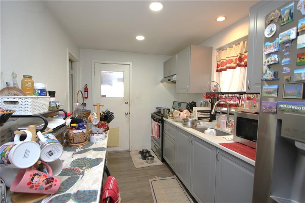 210 Livingston Road West Mifflin, PA 15122 - Photo 4 of 25 a kitchen filled with a white stove top oven sink and a window