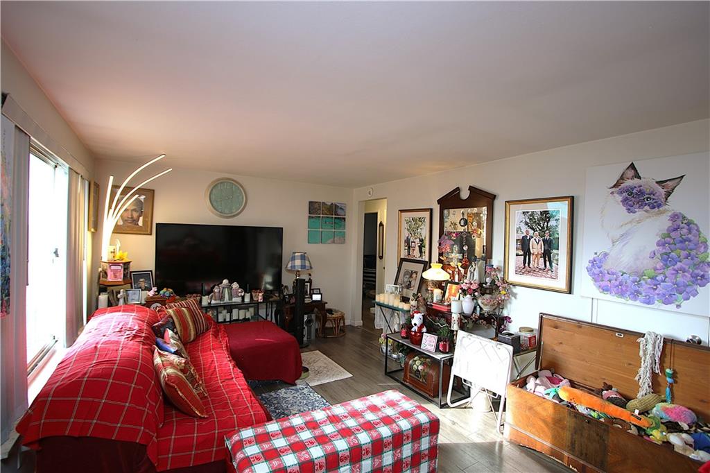 210 Livingston Road West Mifflin, PA 15122 - Photo 6 of 25 a living room with furniture and a flat screen tv