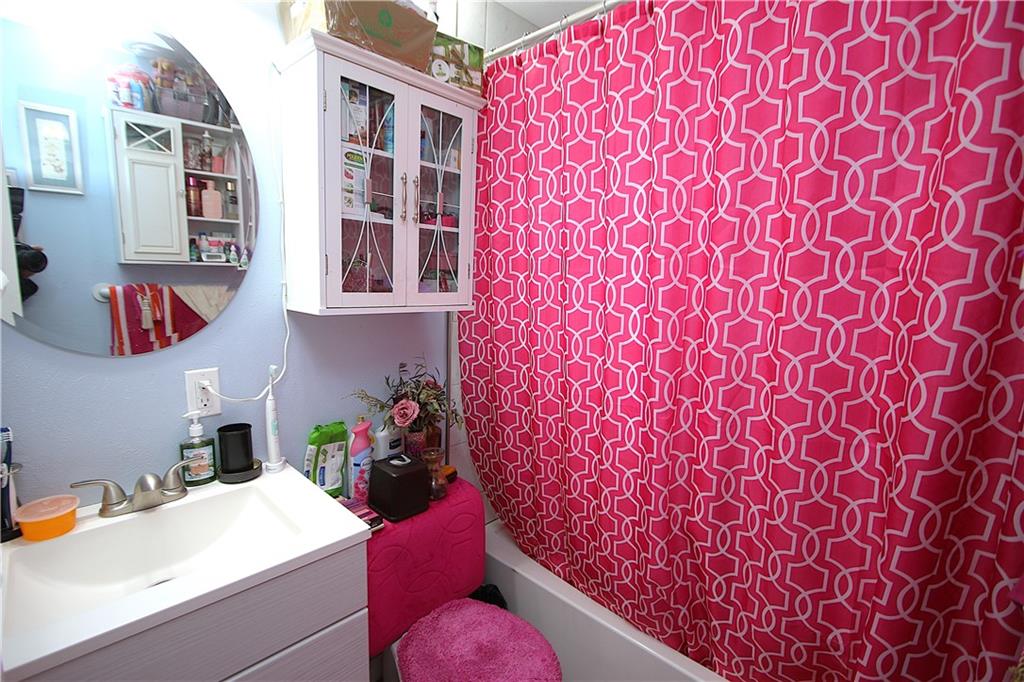 210 Livingston Road West Mifflin, PA 15122 - Photo 10 of 25 a bathroom with a sink toilet and a mirror