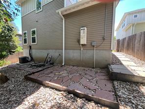 5006 Baker Street, Unit B Austin, TX 78721 - Photo 16 of 16 a view of a backyard with plants and a patio
