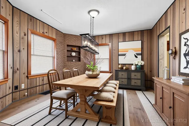 a view of a dining room with furniture window and wooden floor