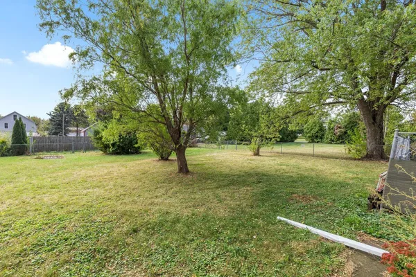 a view of outdoor space with deck and trees