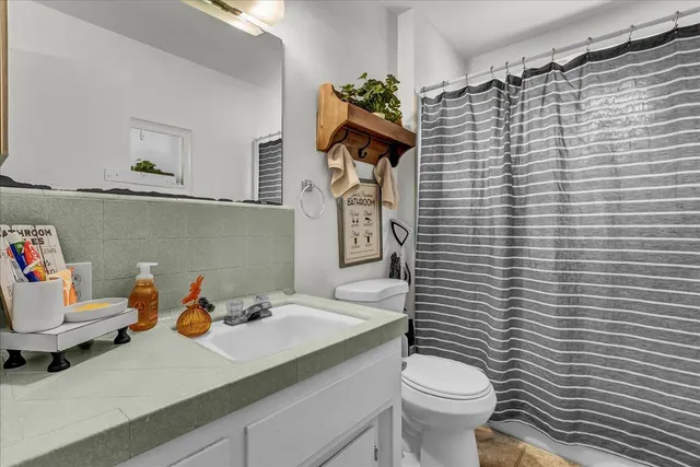 a view of backyard with tub and entertaining space