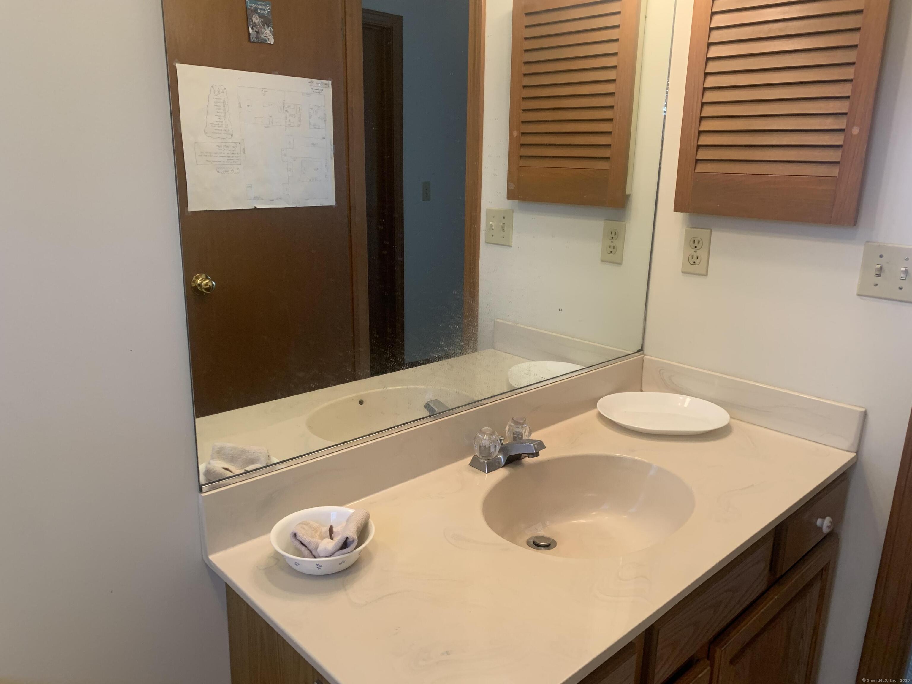58 Amanda Circle Windsor, CT 06095 - Photo 11 of 36 a bathroom with a sink and a mirror