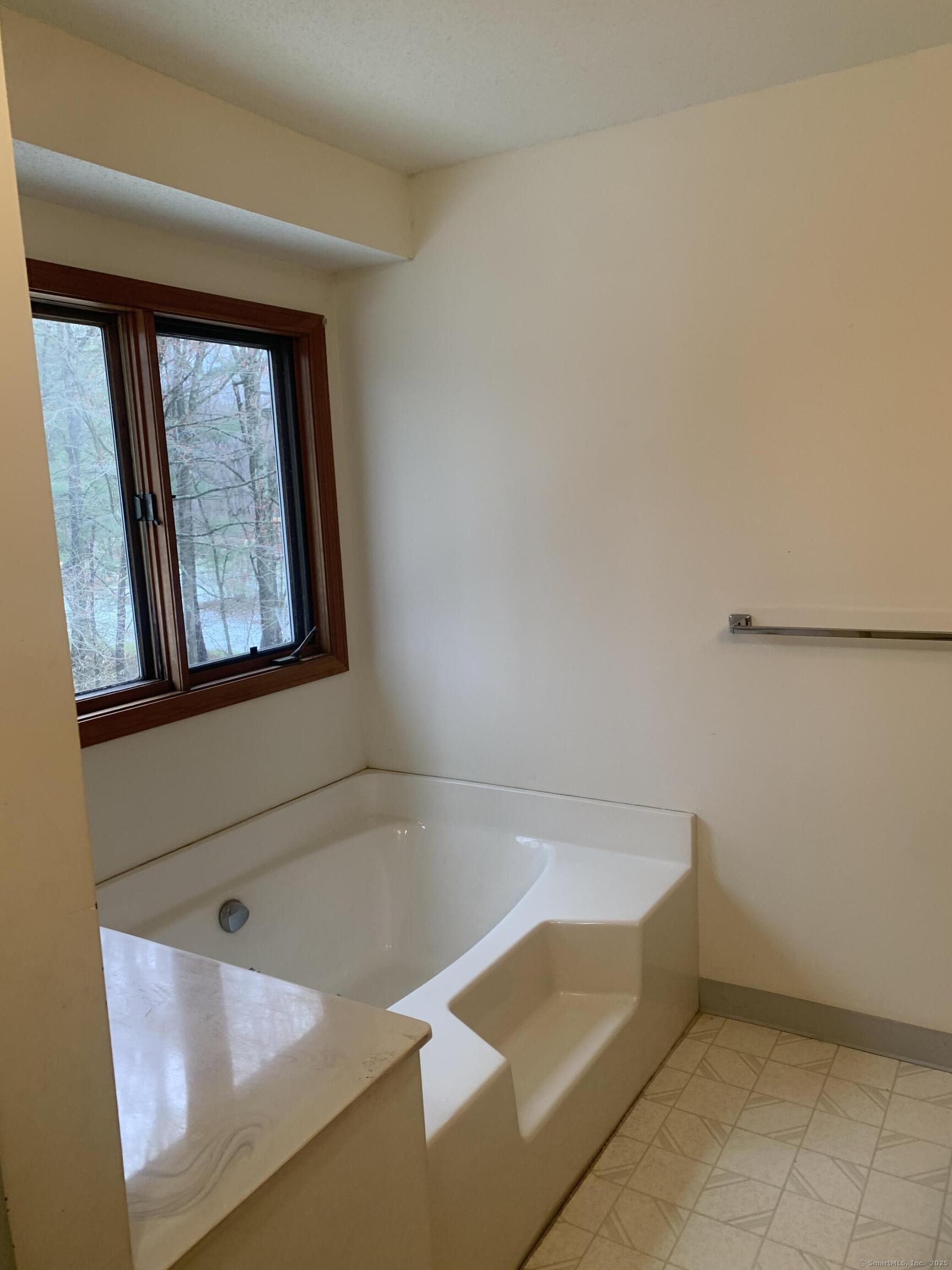58 Amanda Circle Windsor, CT 06095 - Photo 15 of 36 a bathroom with a tub and a window