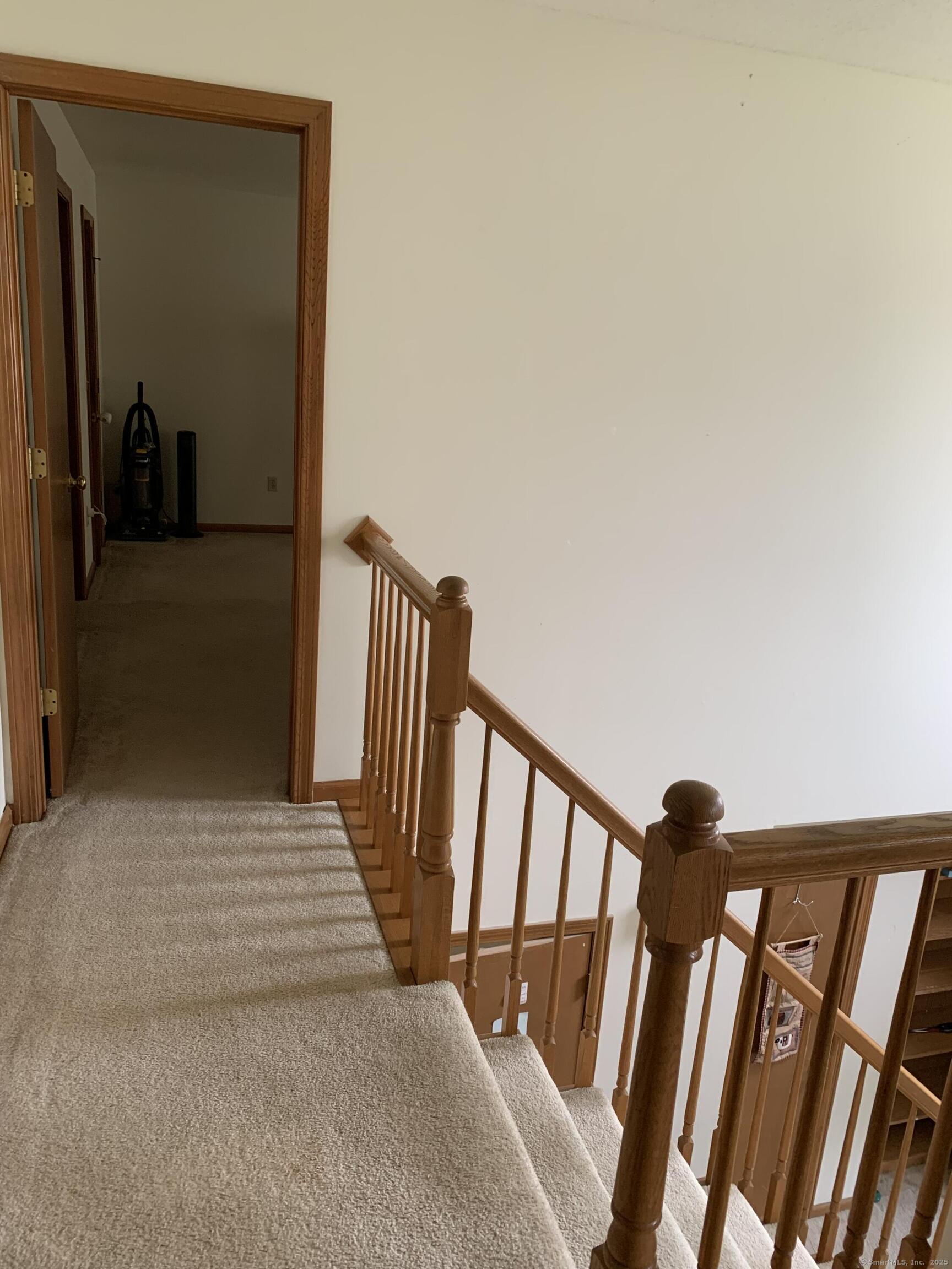 58 Amanda Circle Windsor, CT 06095 - Photo 28 of 36 a view of a hallway to a livingroom with furniture