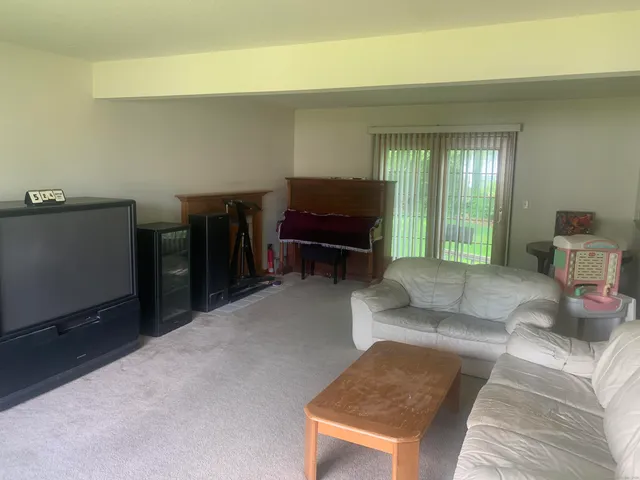 a workspace with furniture and a window