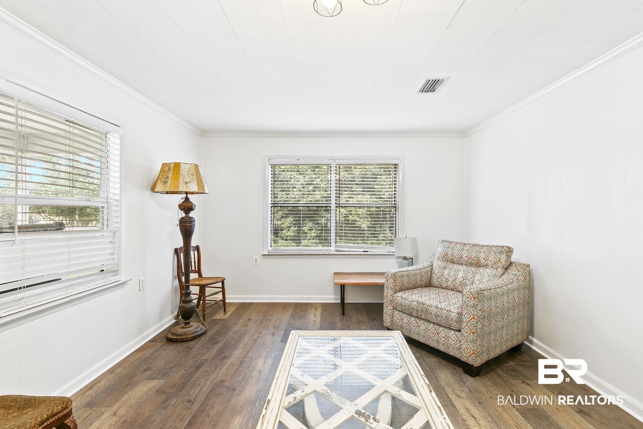 316 West Orchid Avenue Foley, AL 36535 - Photo 10 of 38 Sitting room featuring dark wood finished floors and crown molding