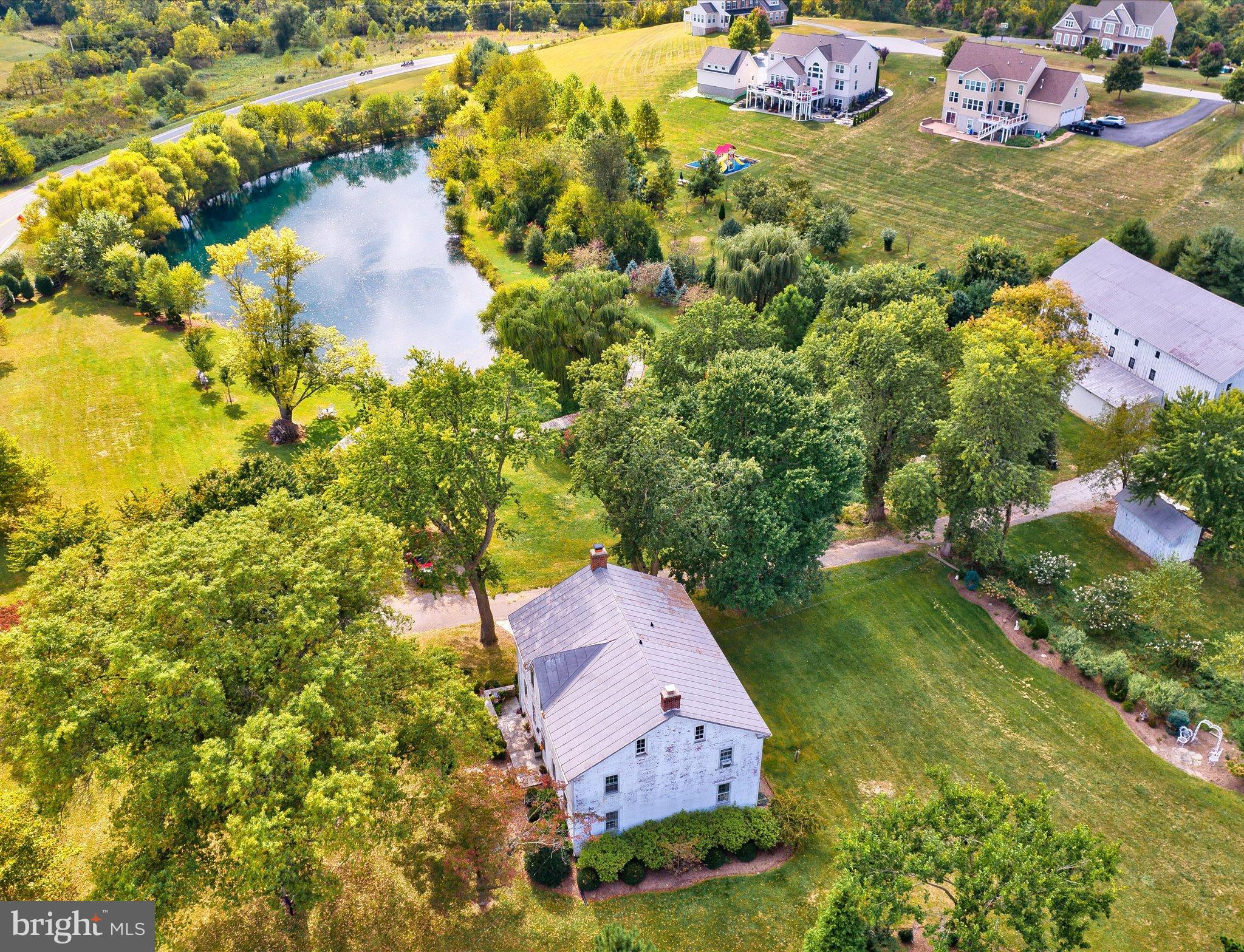 This property has it all! Home, Land, Pond, Barn!