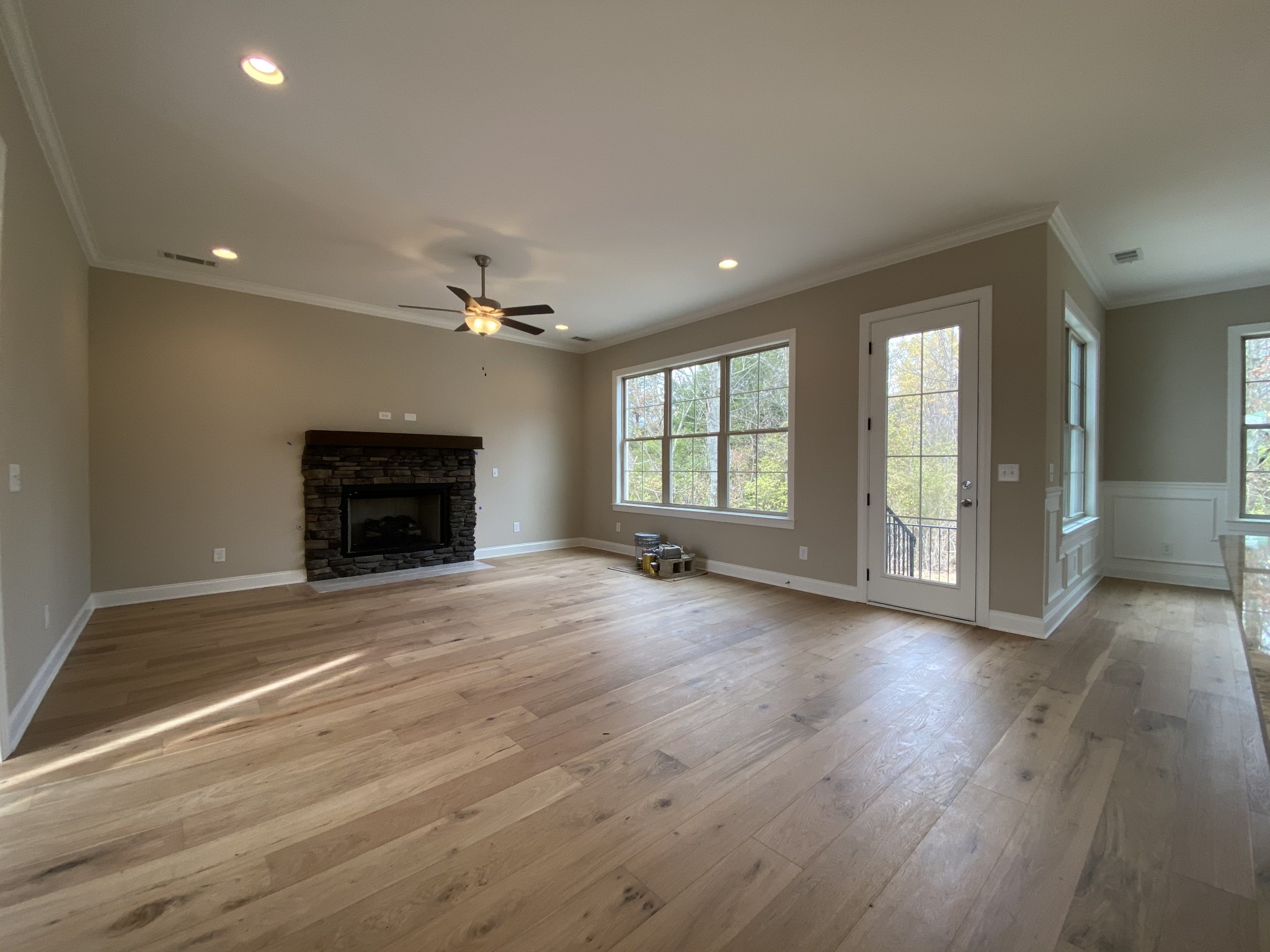 2019 Eagle View Road Hendersonville, TN 37075 - Photo 7 of 19 an empty room with wooden floor fireplace and windows