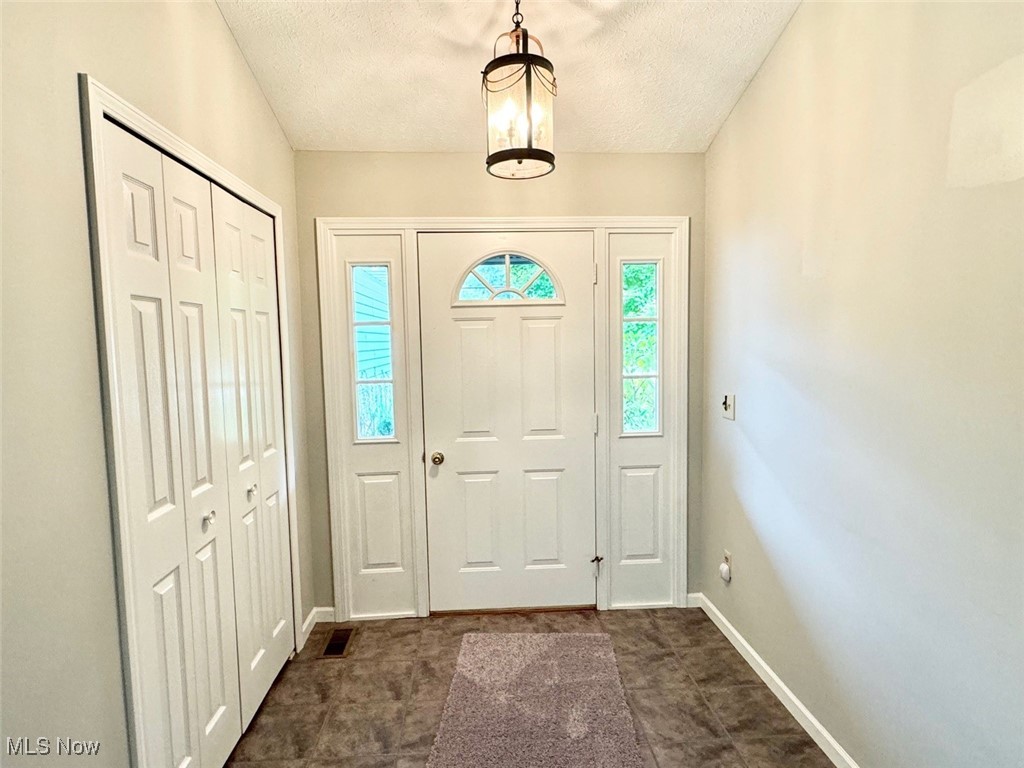 1467 Bennett Road Madison, OH 44057 - Photo 11 of 26 Entrance foyer with a textured ceiling