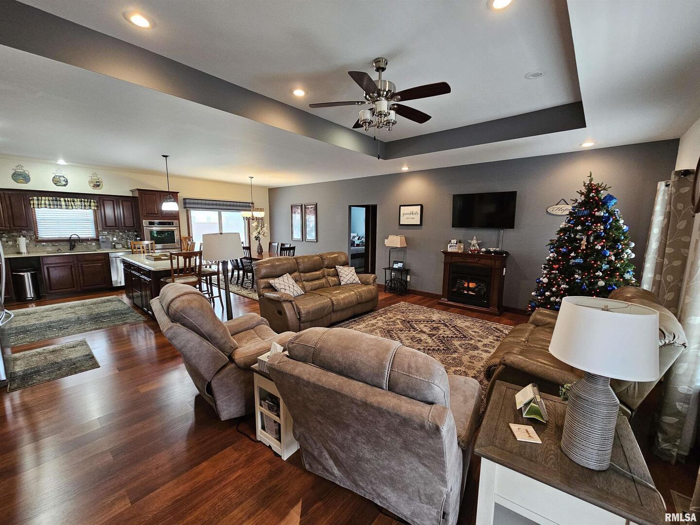 10586 North Spring Garden Lane Mount Vernon, IL 62864 - Photo 18 of 39 a living room with furniture a ceiling fan and a flat screen tv