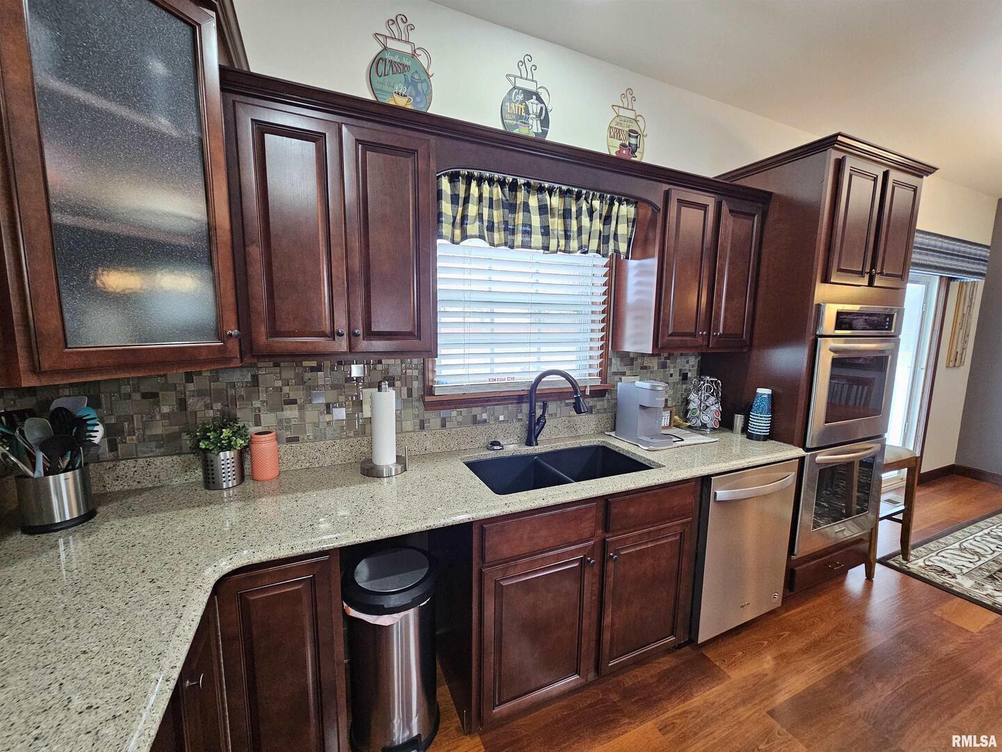 10586 North Spring Garden Lane Mount Vernon, IL 62864 - Photo 23 of 39 a kitchen with stainless steel appliances granite countertop a sink stove and cabinets