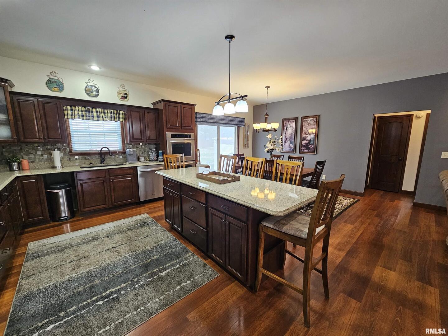 10586 North Spring Garden Lane Mount Vernon, IL 62864 - Photo 25 of 39 a kitchen with stainless steel appliances granite countertop a stove refrigerator and a sink