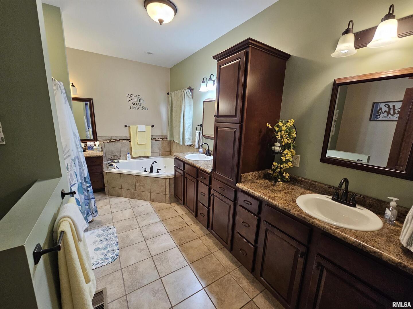 10586 North Spring Garden Lane Mount Vernon, IL 62864 - Photo 31 of 39 a bathroom with a sink double vanity and a mirror