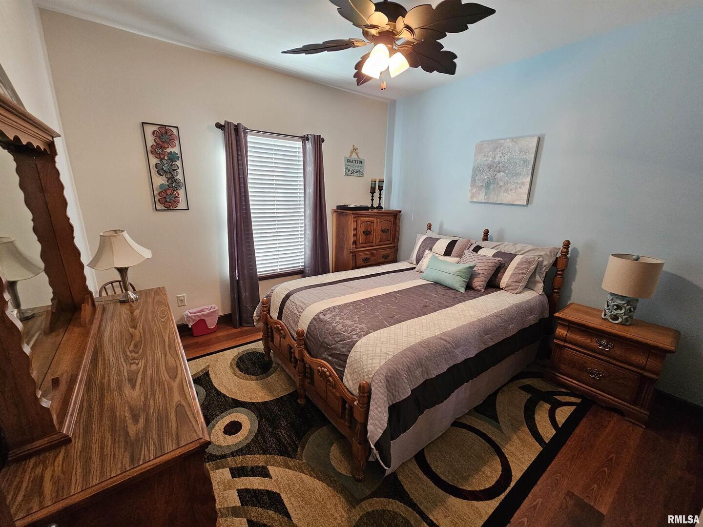 10586 North Spring Garden Lane Mount Vernon, IL 62864 - Photo 36 of 39 a bedroom with bed and a chandelier