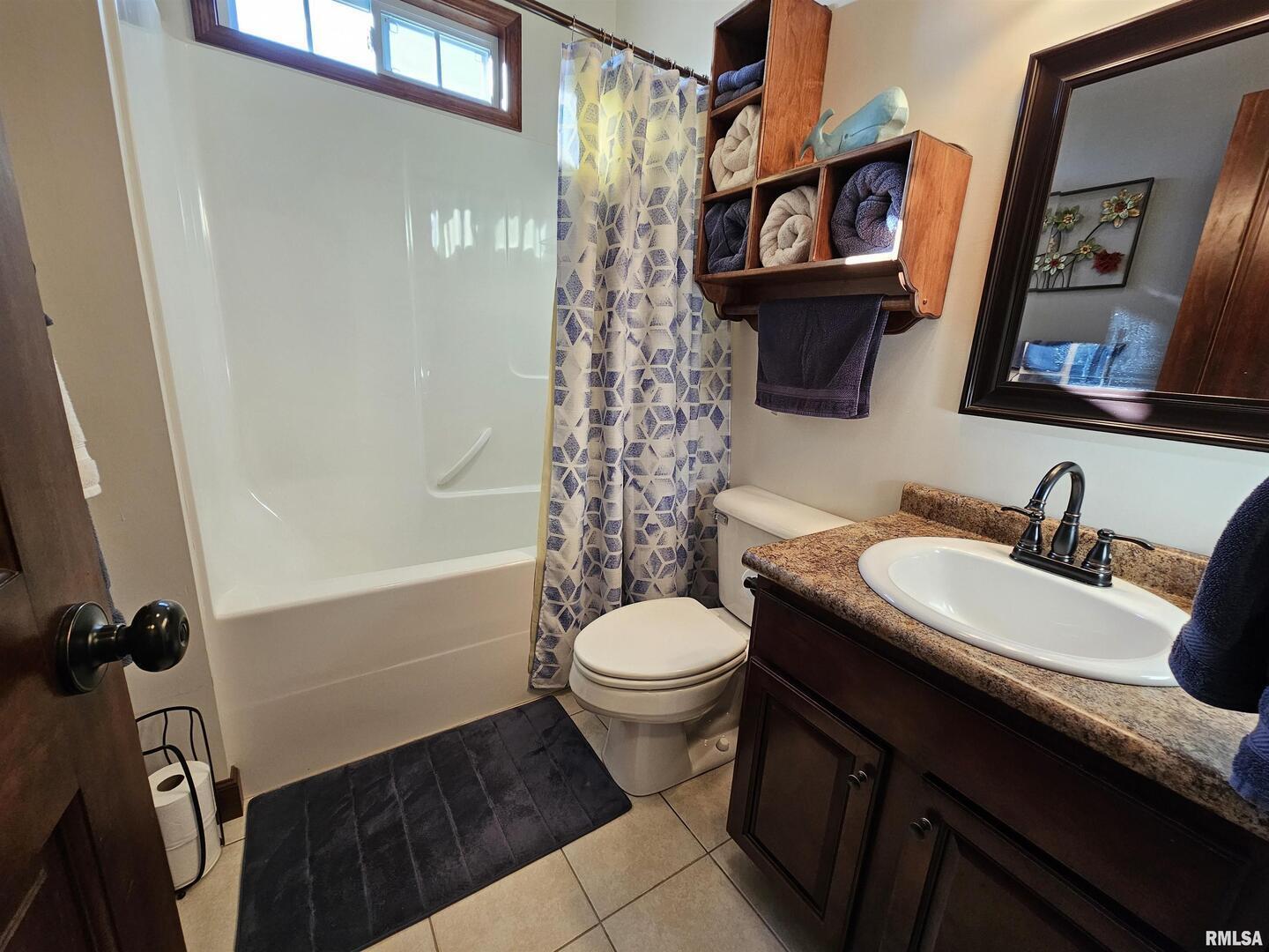 10586 North Spring Garden Lane Mount Vernon, IL 62864 - Photo 37 of 39 a bathroom with a sink a toilet and shower