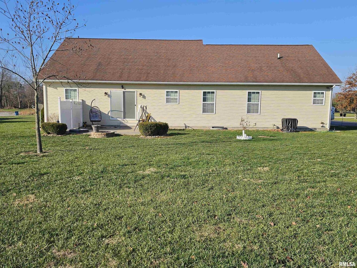 10586 North Spring Garden Lane Mount Vernon, IL 62864 - Photo 6 of 39 a view of a house with a yard and sitting area