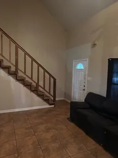 a view of an empty room with stairs