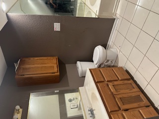 1017 West 3rd Street Taylor, TX 76574 - Photo 15 of 23 a bathroom with a toilet sink and mirror