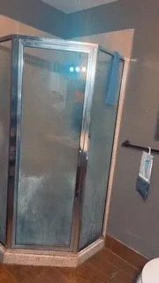 a bedroom with a bed and a lamp on table