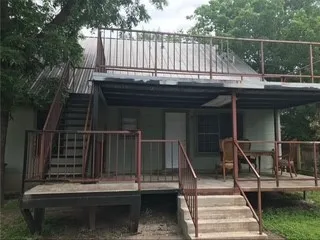 a backyard of a house with seating space