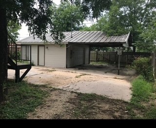 1017 West 3rd Street Taylor, TX 76574 - Photo 3 of 23 a backyard of a house with seating space