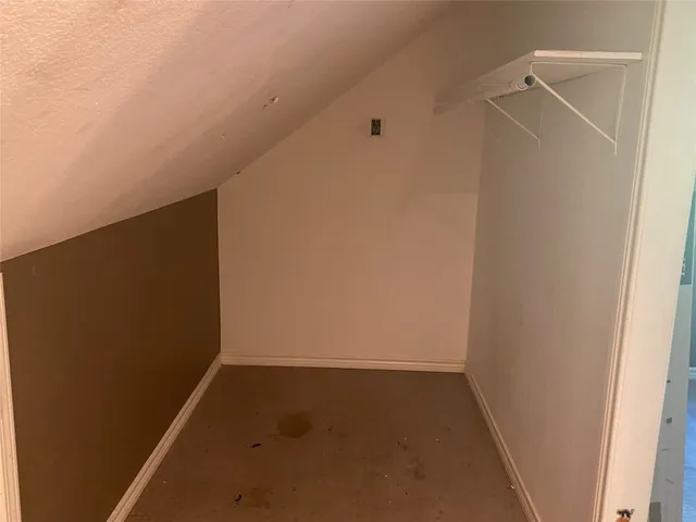 a large kitchen with kitchen island granite countertop a sink counter top space and stainless steel appliances