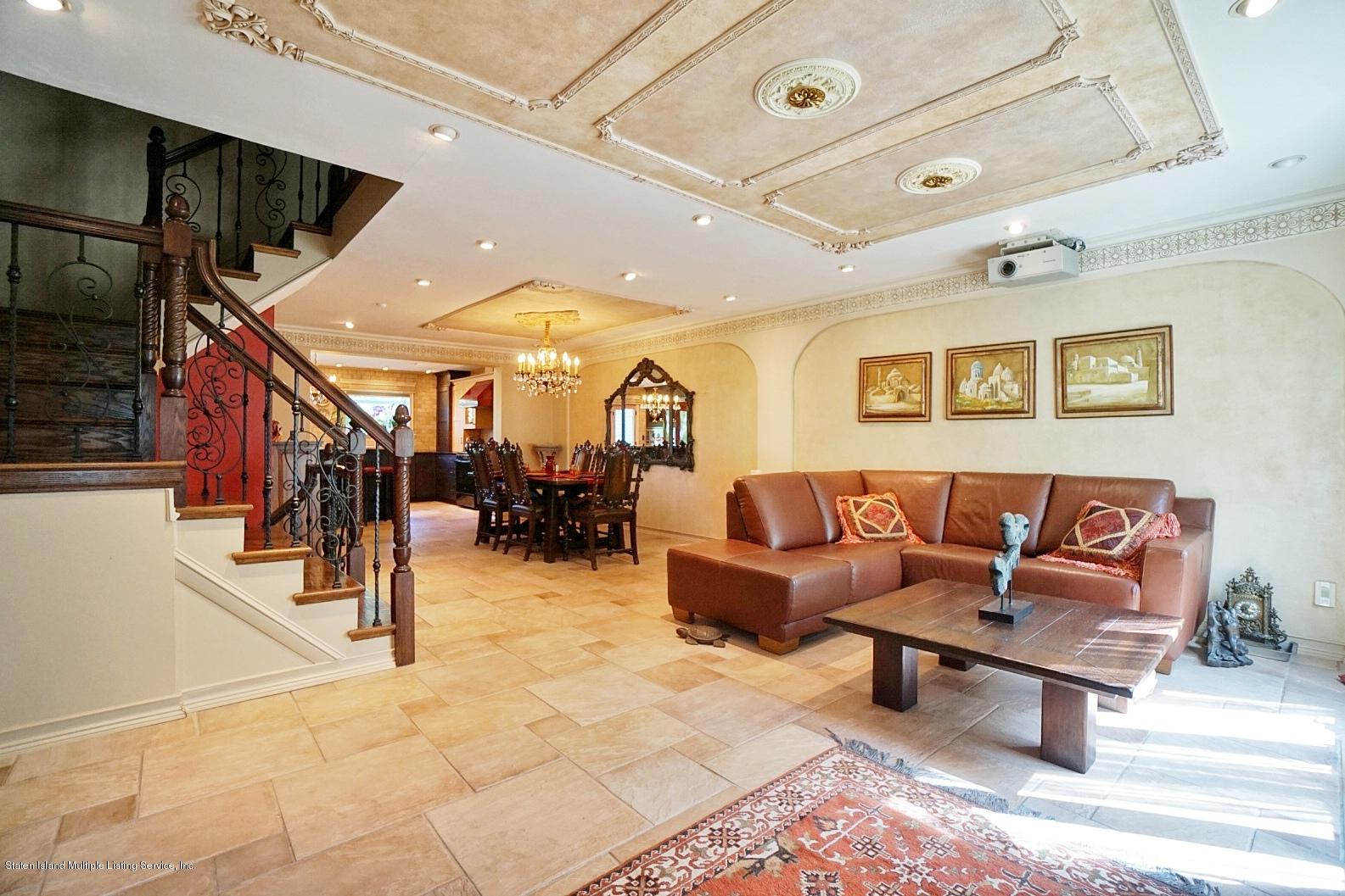 178 Admiralty Loop Staten Island, NY 10309 - Photo 11 of 50 a living room with lots of furniture and view of kitchen