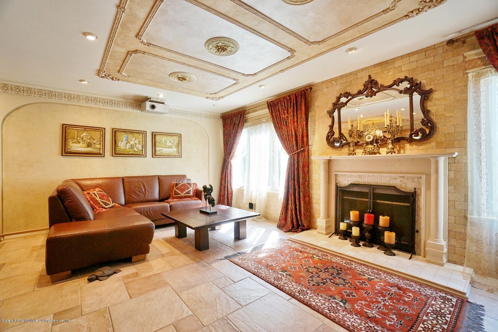 178 Admiralty Loop Staten Island, NY 10309 - Photo 13 of 50 a living room with furniture and a fireplace