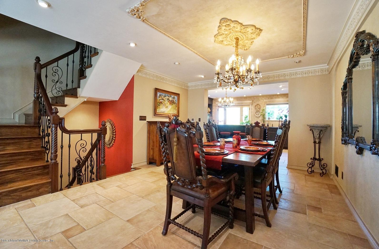 178 Admiralty Loop Staten Island, NY 10309 - Photo 14 of 50 a view of a dining room with furniture and a chandelier