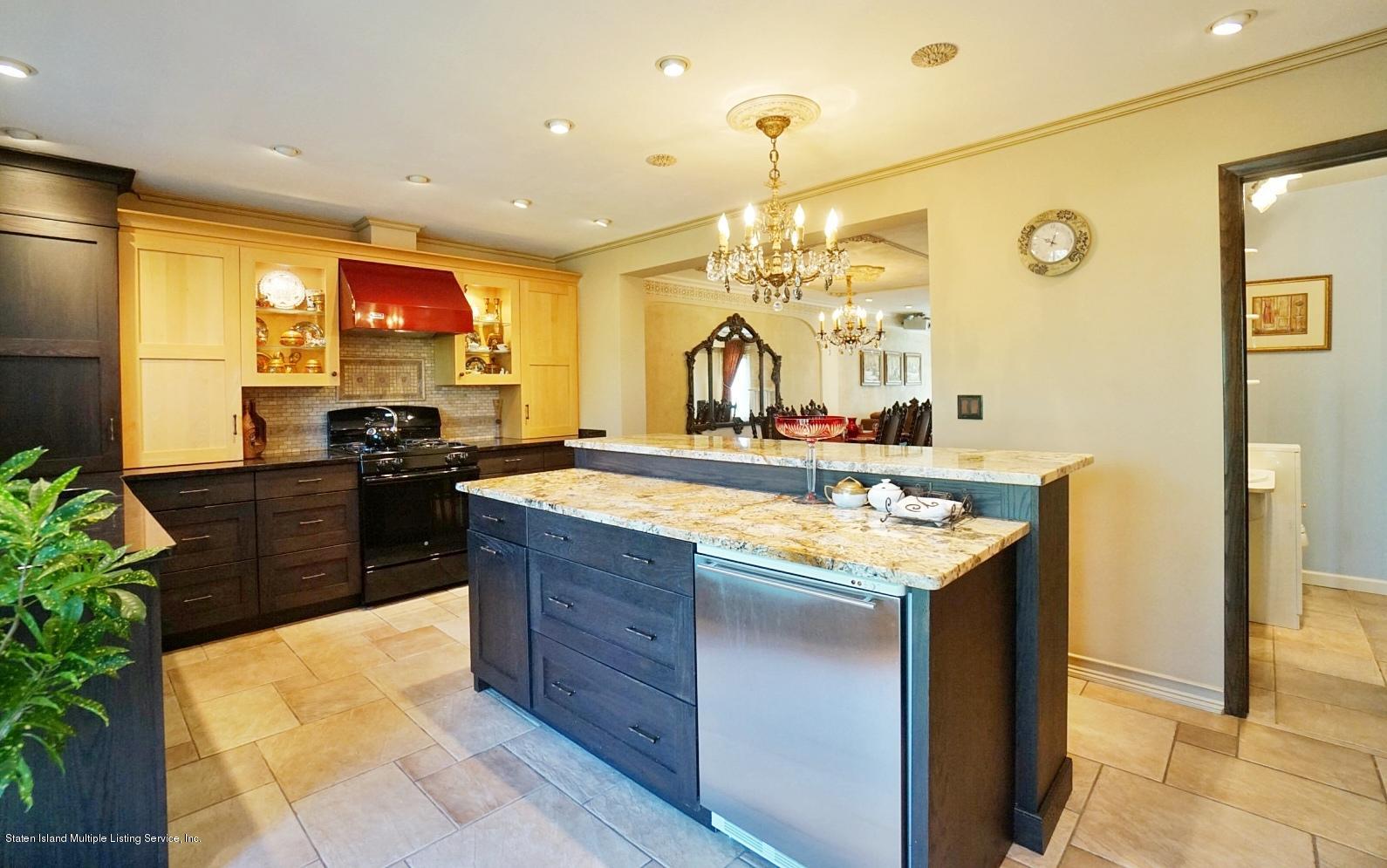 178 Admiralty Loop Staten Island, NY 10309 - Photo 19 of 50 a kitchen with kitchen island granite countertop a sink and a stove