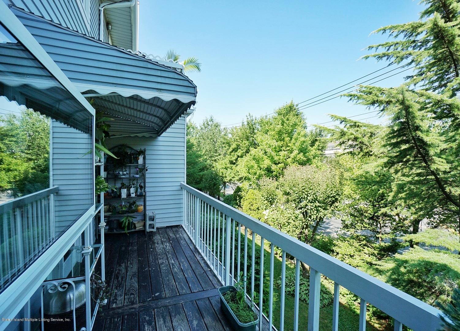 178 Admiralty Loop Staten Island, NY 10309 - Photo 21 of 50 a view of a balcony with wooden stairs and floor