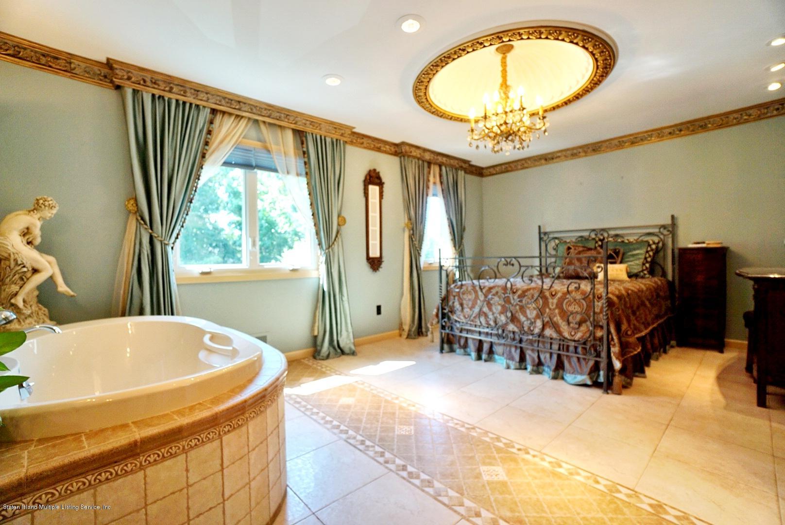 178 Admiralty Loop Staten Island, NY 10309 - Photo 25 of 50 a bedroom with a bed and window